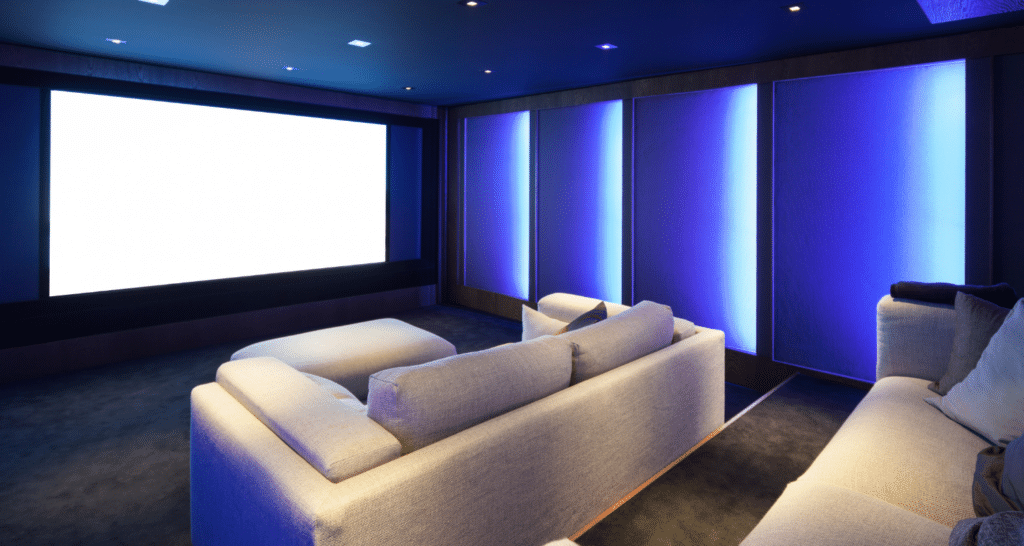 home theatre design with tiered seating and ambient lighting on the walls