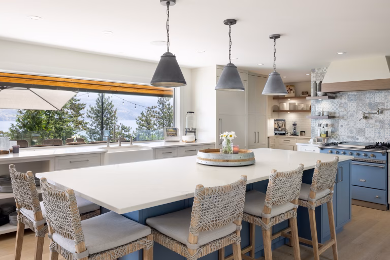 High-end kitchen with marble island by Lux Quality Homes